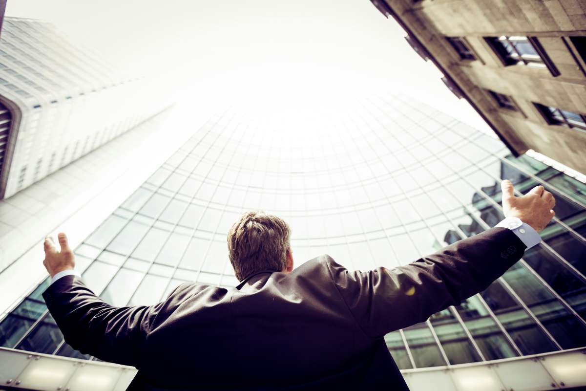 Man in front of tall building